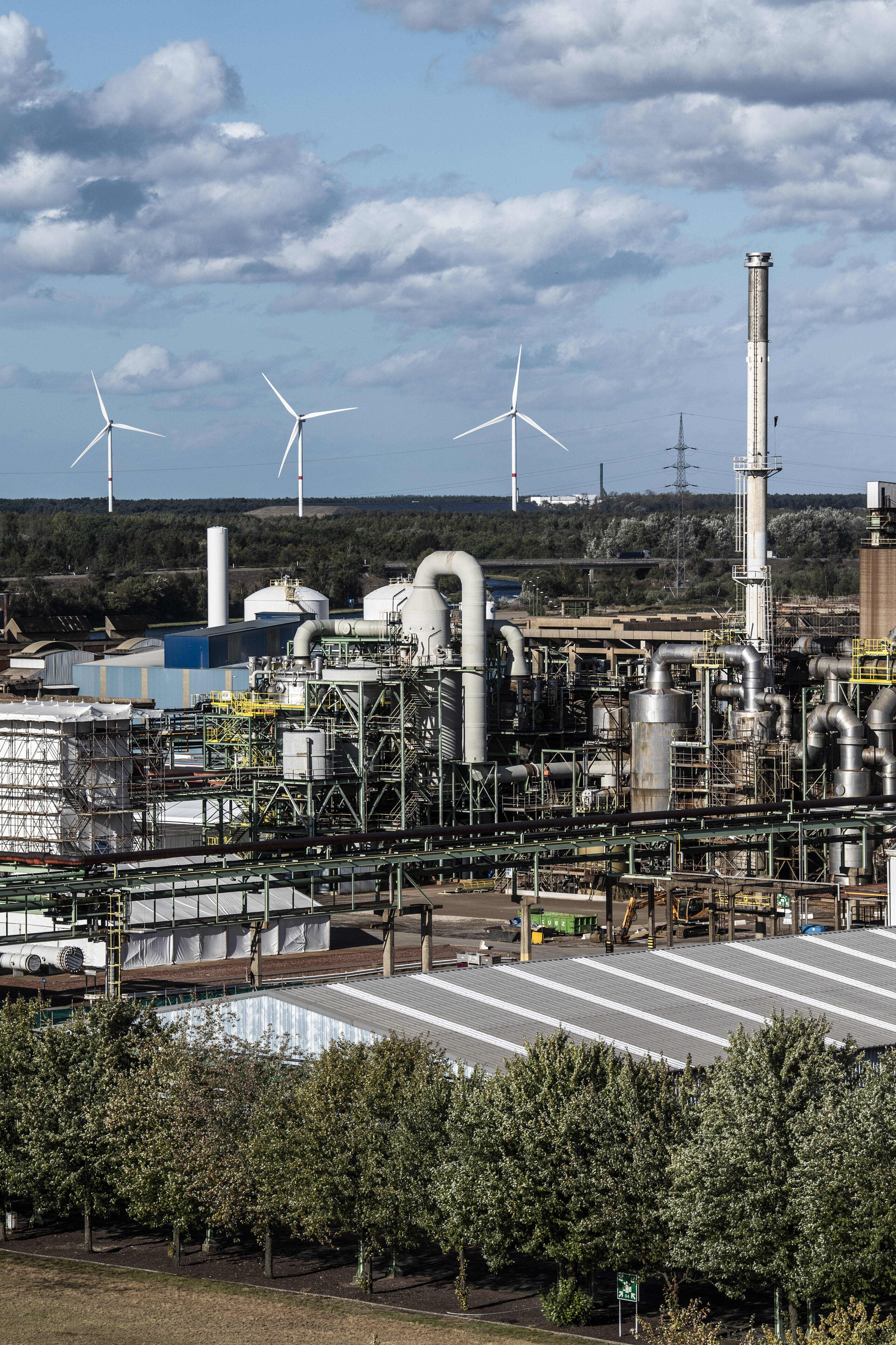 The three new wind turbines tower high above the site of Nyrstar Pelt